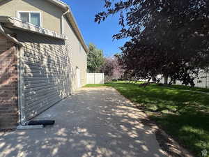 View of property exterior with brick siding and stucco siding