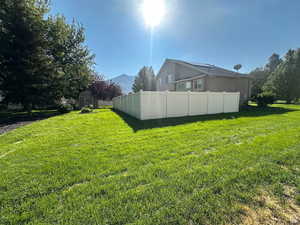 View of yard with a storage unit and a mountain view
