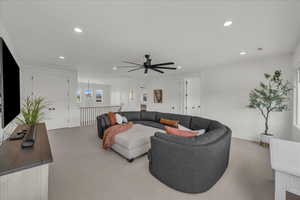 Living room featuring carpet, recessed lighting, and ceiling fan