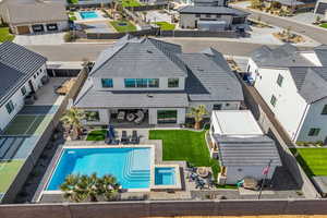 Back of property featuring a patio area, a fenced backyard, and a residential view