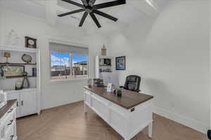 Office area with parquet floors, beamed ceiling, and a ceiling fan