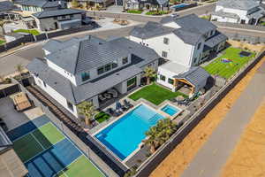 Aerial perspective of suburban area with a pool area