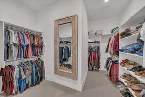 Walk in closet featuring carpet floors