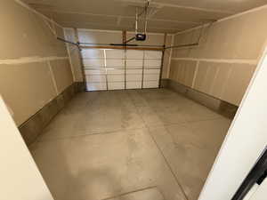 Garage featuring a garage door opener