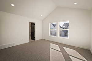 Carpeted empty room with recessed lighting and baseboards