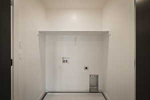 Laundry room featuring hookup for an electric dryer and hookup for a washing machine