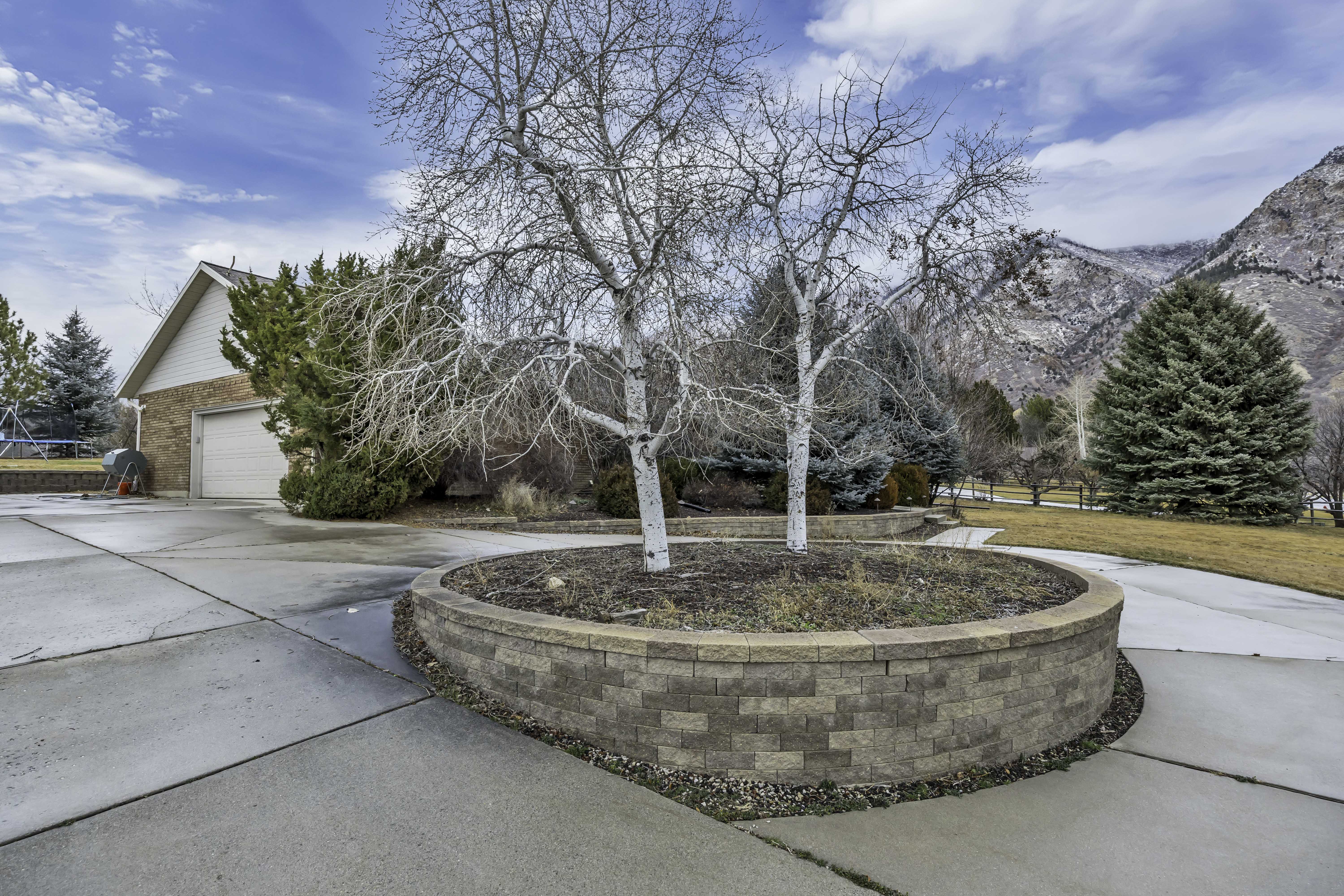 Surrounding community featuring driveway and a garage