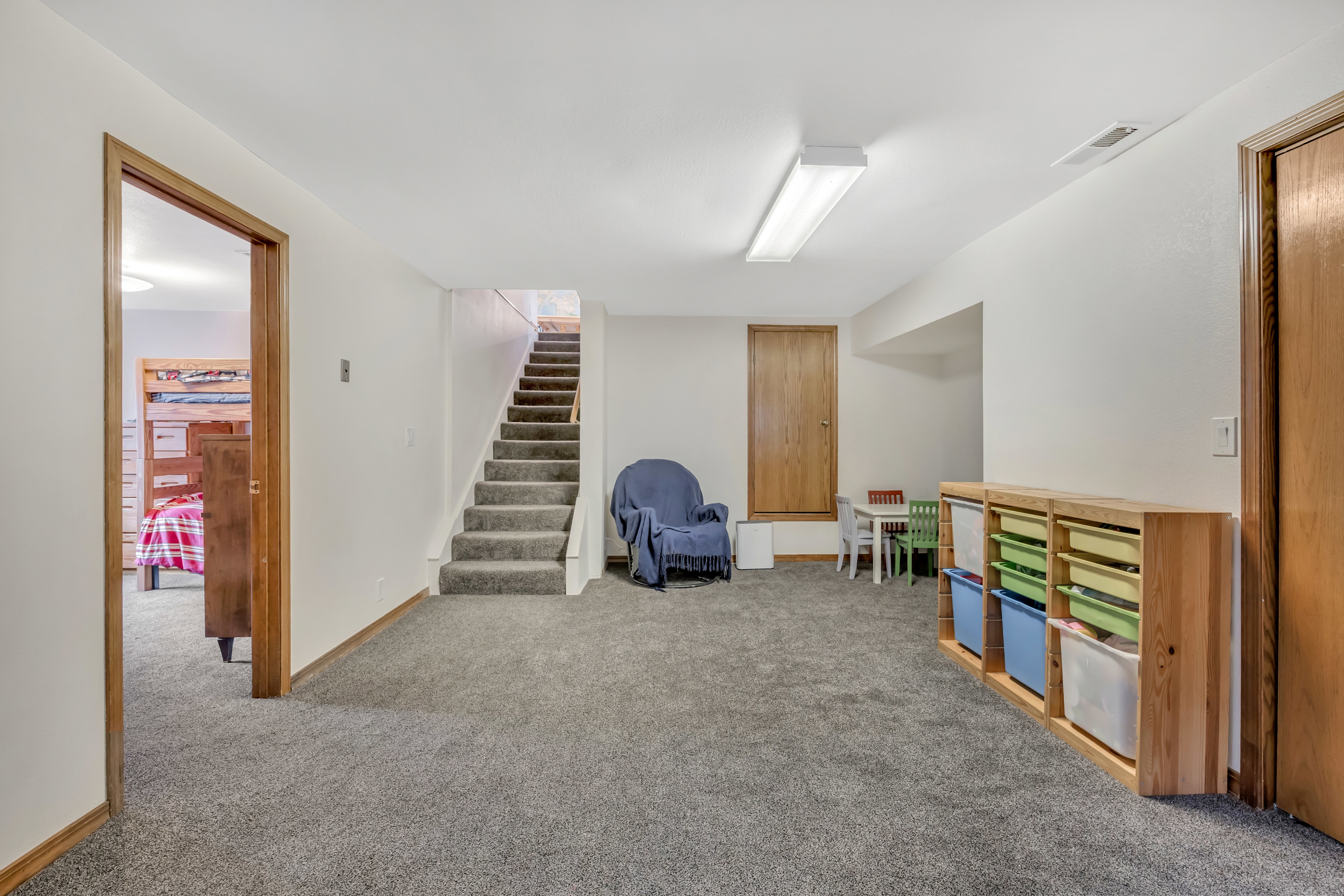 Rec room featuring carpet floors and baseboards