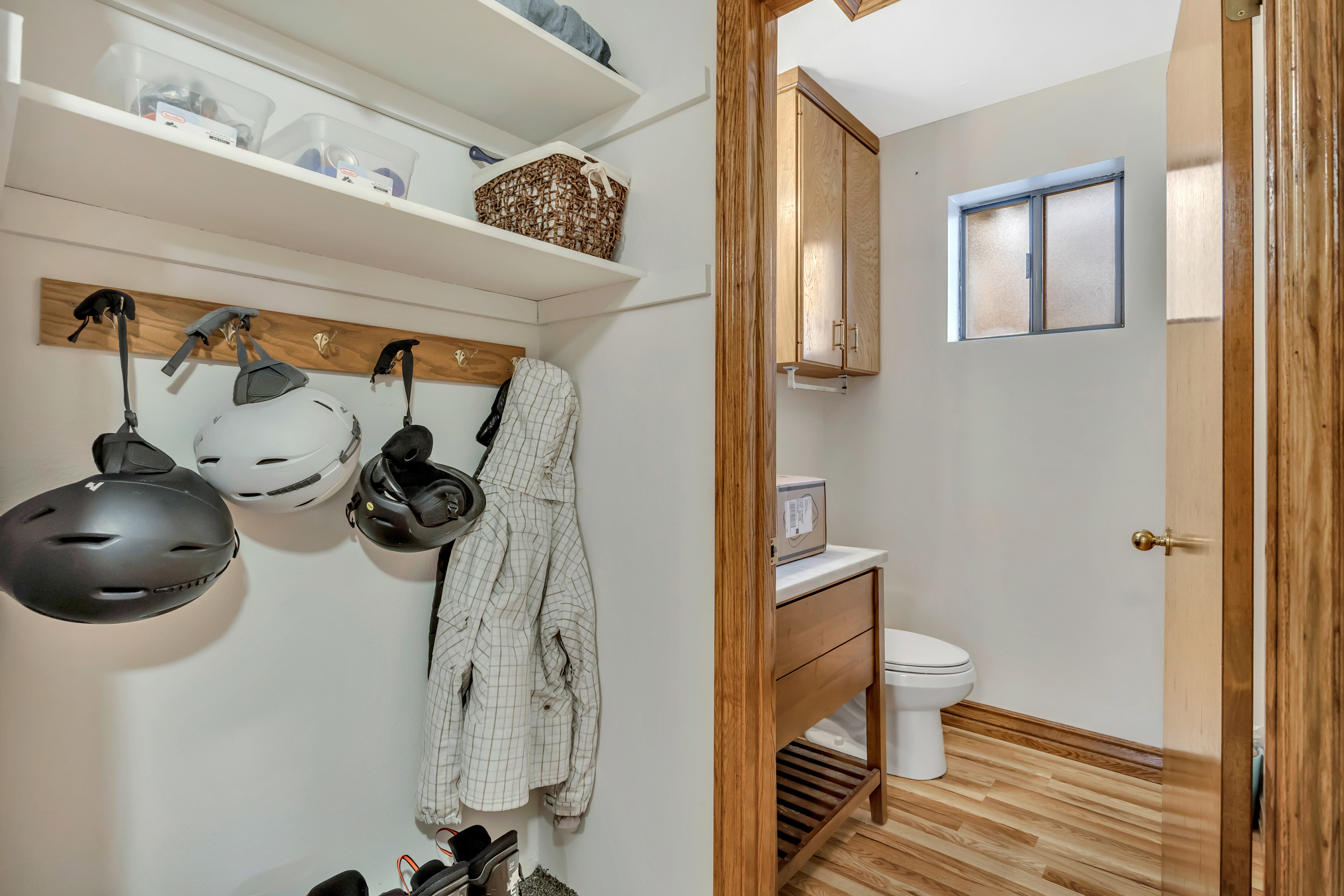 Half bathroom featuring light wood-style flooring and vanity