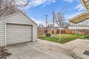 Detached garage featuring driveway