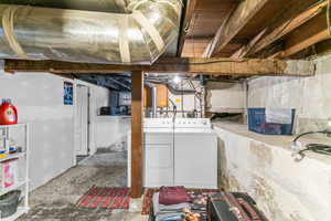 Unfinished basement with washer and dryer