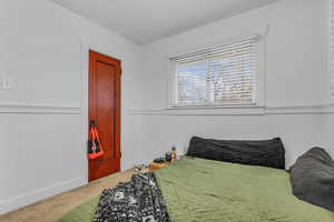 Bedroom with carpet flooring