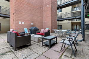 Patio / terrace with a patio, an outdoor living / dining area, and area for grilling