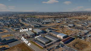 Aerial view of property's location with an industrial area