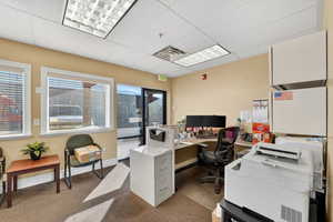 Office featuring a drop ceiling