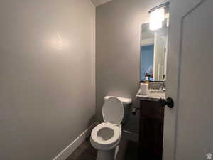 Bathroom featuring vanity and dark wood finished floors