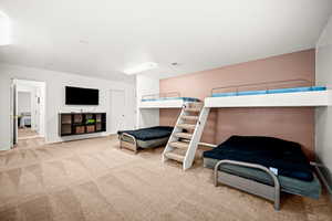 Carpeted bedroom with baseboards
