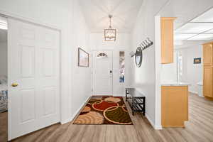 Entryway featuring light wood-type flooring and baseboards