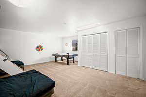 Game room featuring carpet and baseboards
