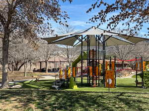 Community playground featuring a lawn
