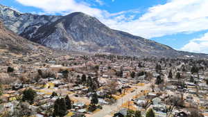 View of mountain backdrop featuring nearby suburban area