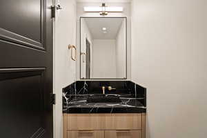 Bathroom featuring vanity and recessed lighting