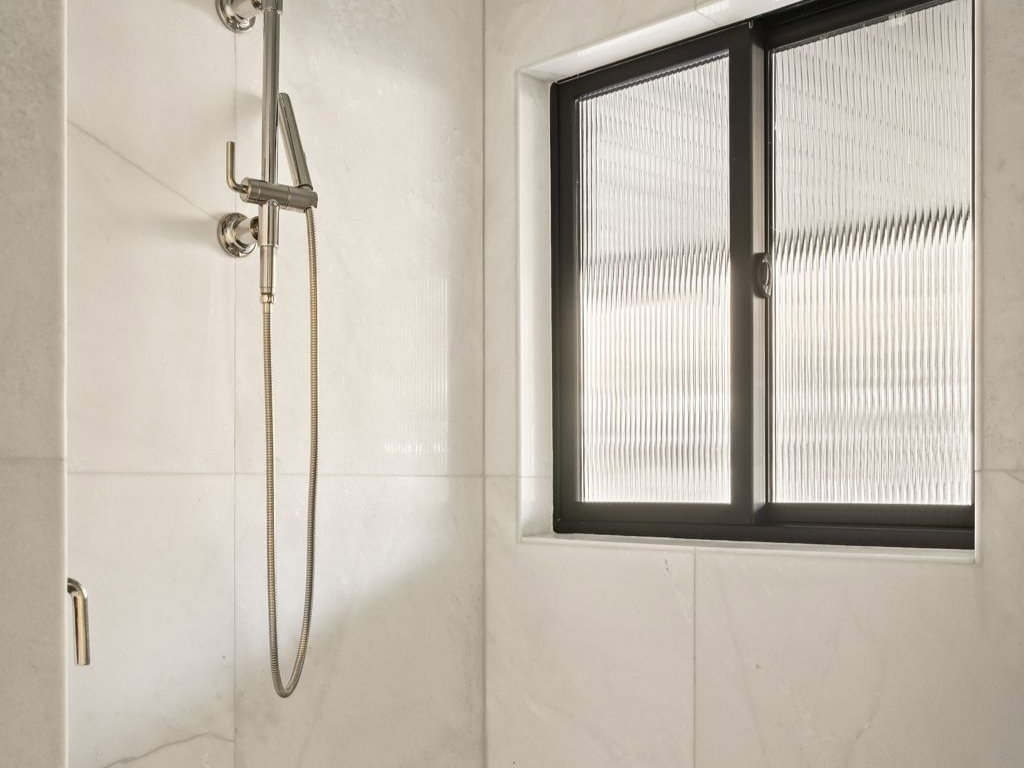 Full bath with a shower stall