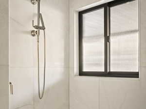 Full bath with a shower stall