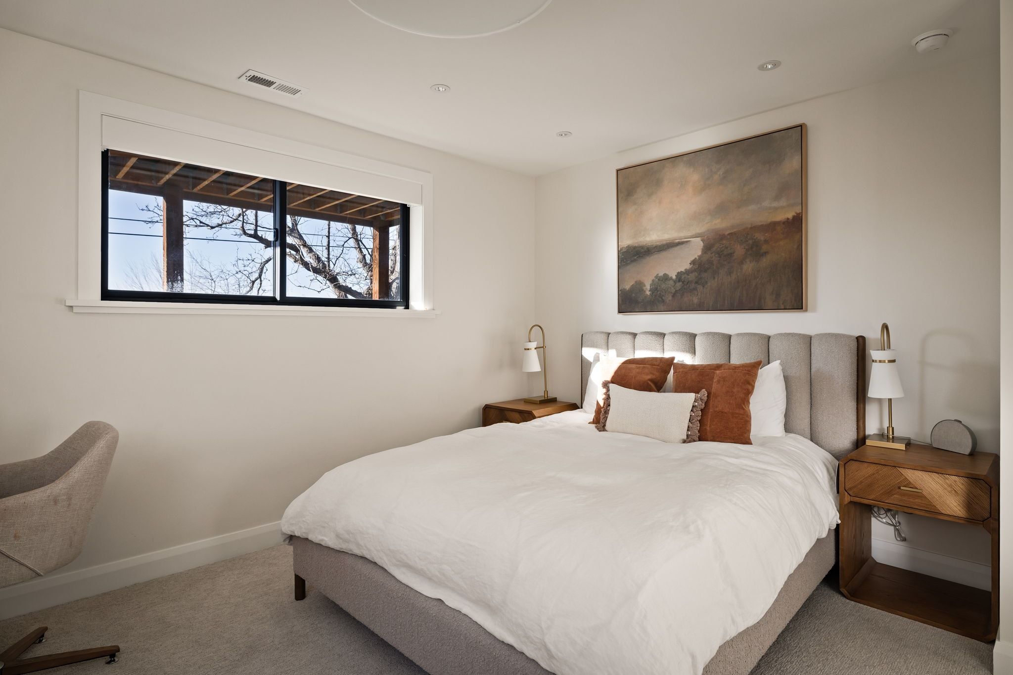 Bedroom featuring carpet floors and baseboards