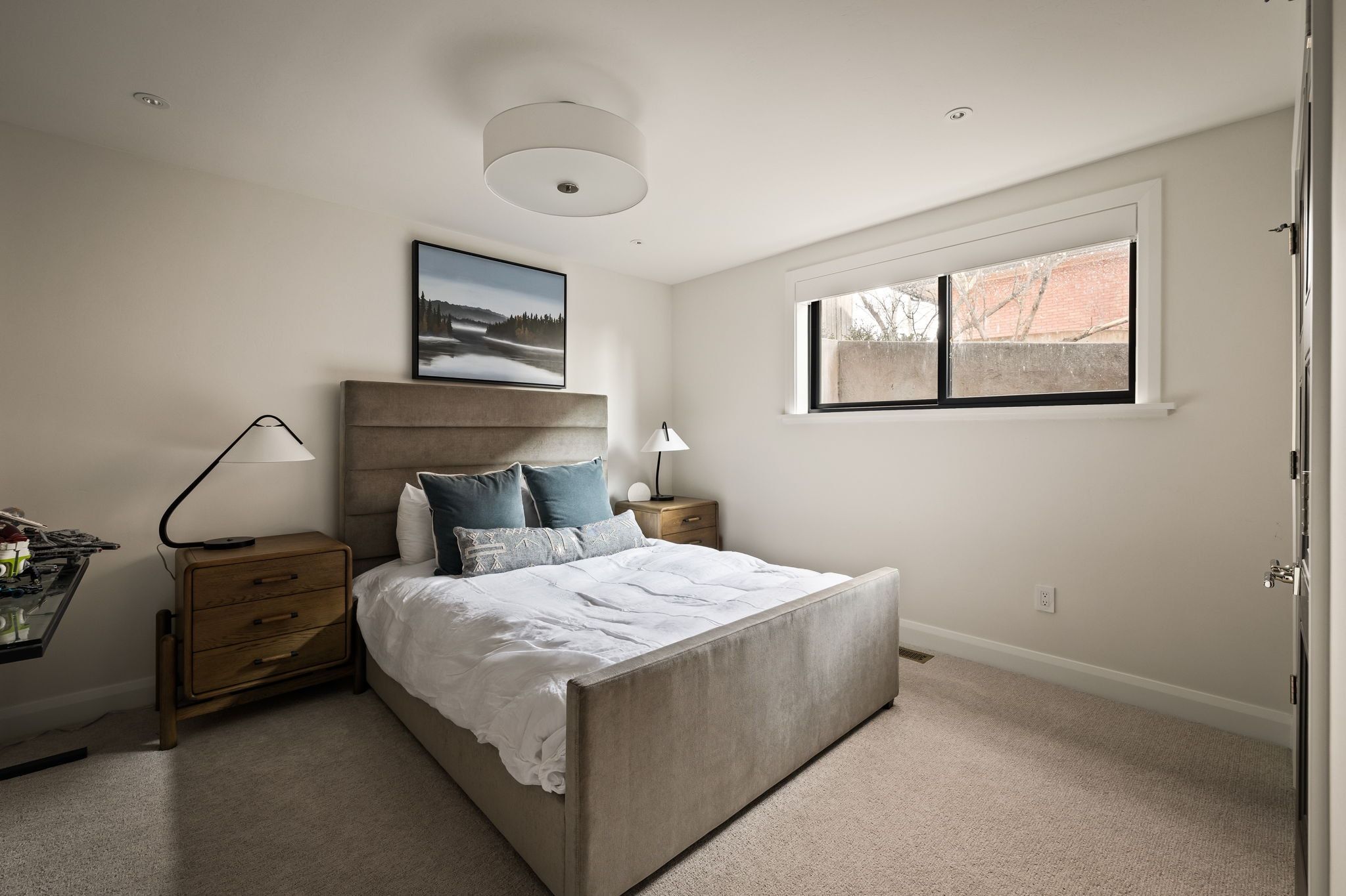 Carpeted bedroom featuring baseboards
