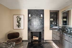 Living room with a tile fireplace