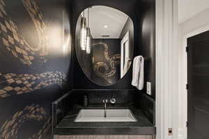 Bathroom featuring vanity and recessed lighting