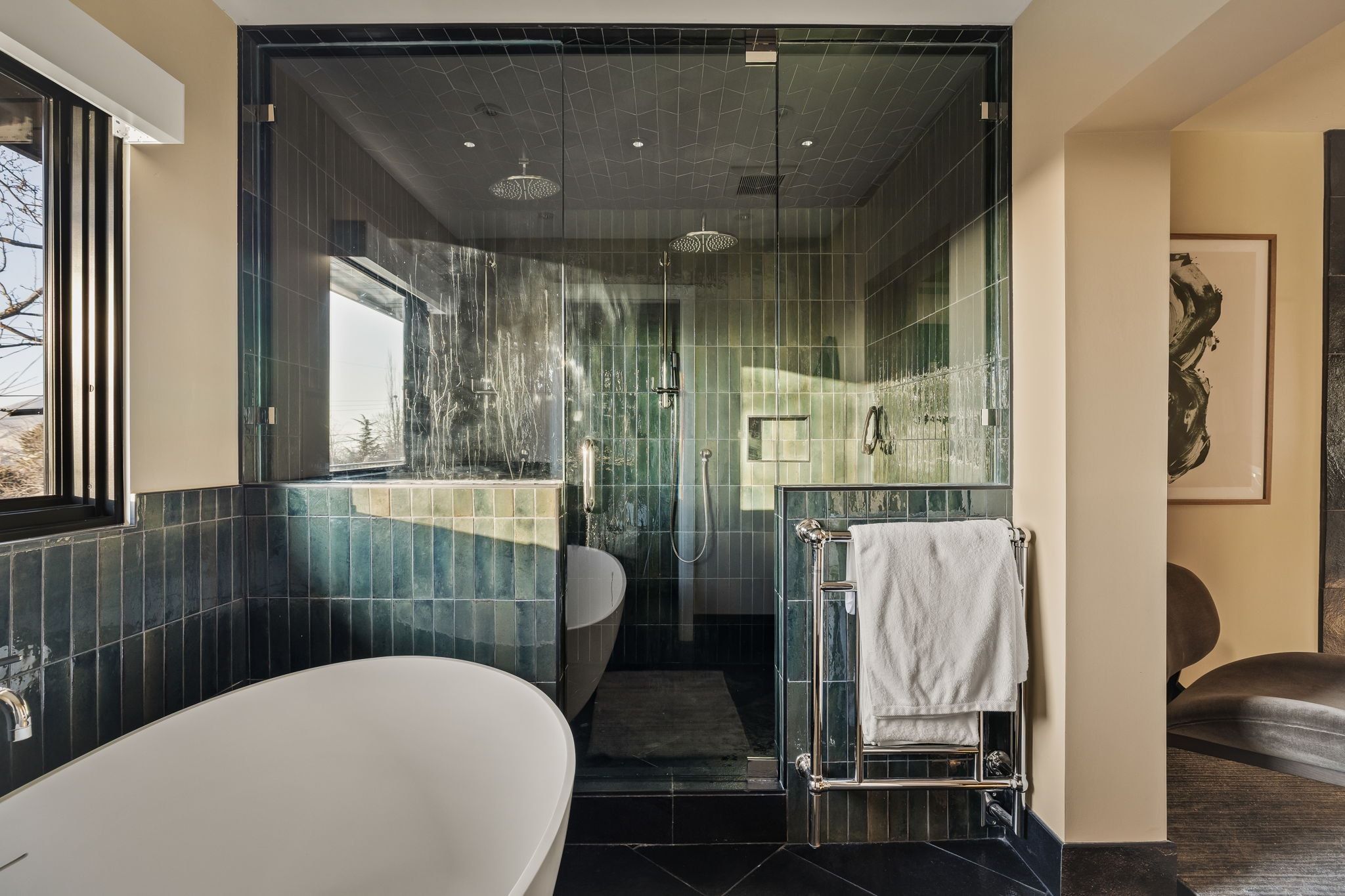 Full bathroom featuring a freestanding bath, a shower stall, tile walls, and tile patterned flooring