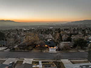 Aerial perspective of suburban area with a mountainous background