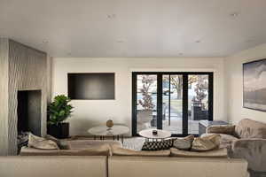 Living room with recessed lighting and a fireplace
