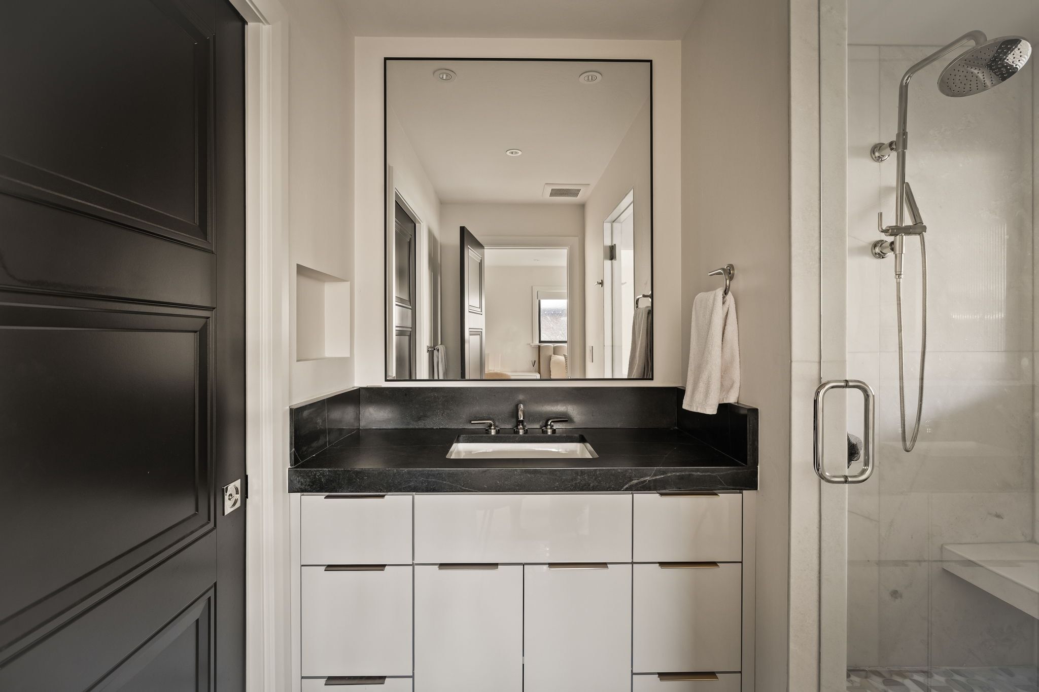 Full bathroom with a shower stall and vanity