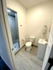 Basement Bathroom featuring vanity and a shower stall