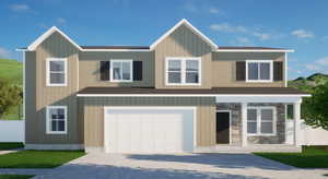 View of front of house featuring an attached garage, concrete driveway, and stone siding