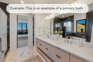 Bathroom with a stall shower, double vanity, light marble finish flooring, and plenty of natural light