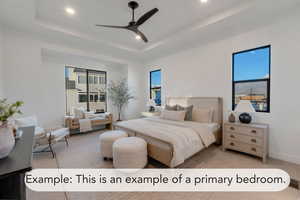 Bedroom with ceiling fan, recessed lighting, multiple windows, a tray ceiling, and light carpet