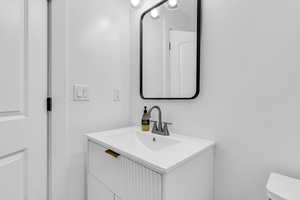 Bathroom with vanity and toilet