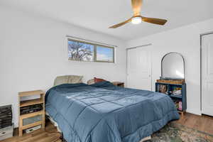 Bedroom with wood finished floors and ceiling fan