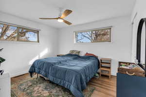 Bedroom with wood finished floors and ceiling fan