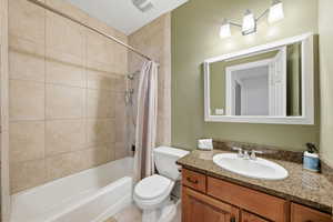 Bathroom featuring vanity and shower / bath combo