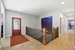 Entryway with baseboards and recessed lighting