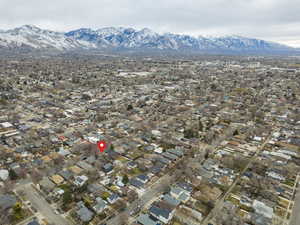 Aerial perspective of suburban area featuring a mountainous background