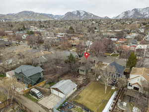 View of property location featuring nearby suburban area and a mountain backdrop