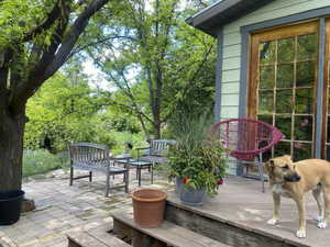 View of patio with a wooden deck