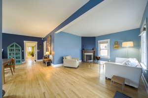 Living room with hardwood / wood-style floors and a fireplace