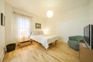 Bedroom featuring wood finished floors